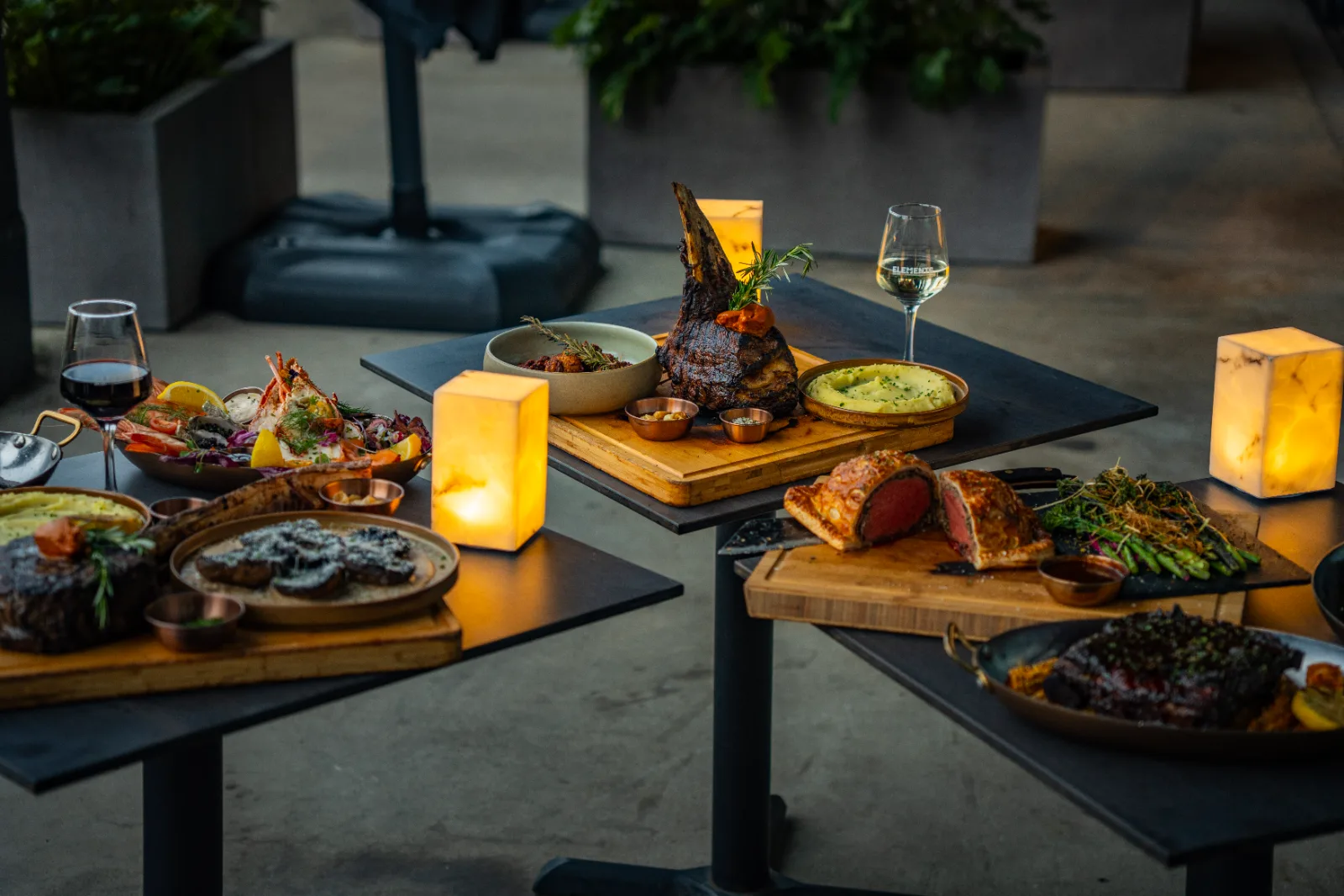 A Christmas feast for the table at Elements Bar & Grill: roast meats, seafood and sides by candlelight