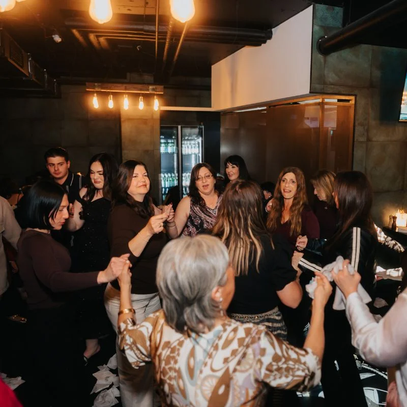 Guests dancing together at Greek Night, Elements Brasserie Belmore